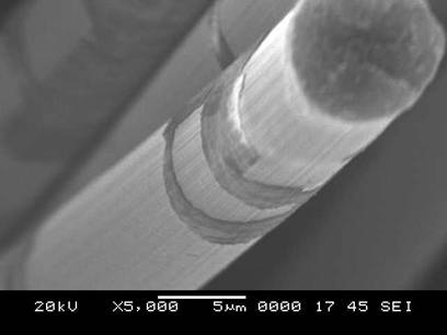 SEM image showing zirconium oxide/hafnium oxide multilayered interface coatings on carbon fibers